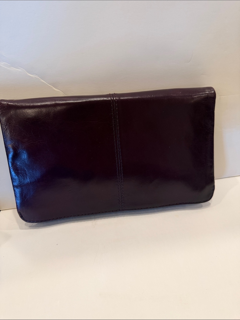 HOBO women’s Leather Clutch in Dark Plum